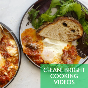 two plates with sauce, cheese, bread, and lettuce