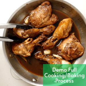 chicken in a pan being turned with tongs