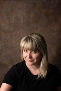 woman with blond hair smiling at the camera