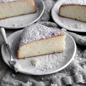 three slices of Irish tea cake with powdered sugar on a plate