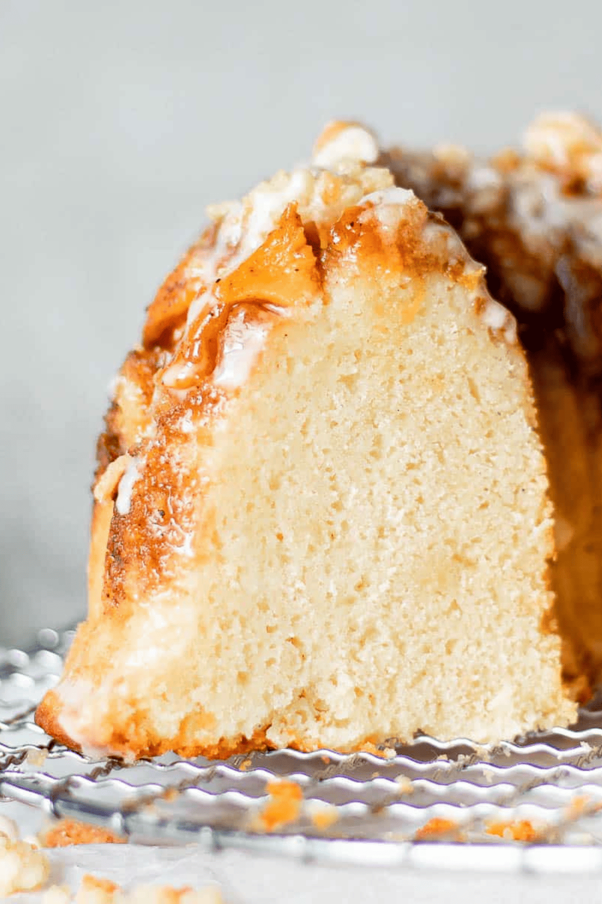 sliced open bundt cake on a cooling rack
