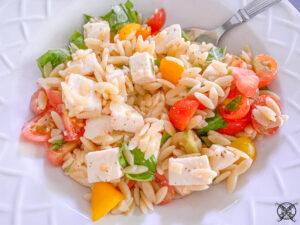 pasta dish with chicken and veggies in a bowl