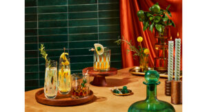 A tablescape featuring a Jetson's themed cocktail party, with deep green details